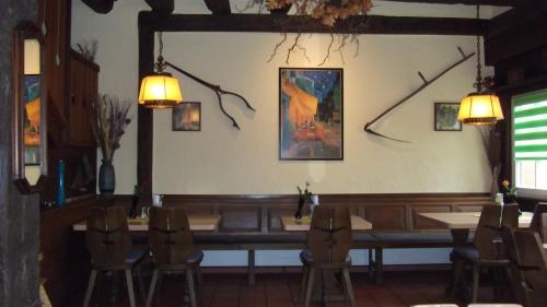 a dining room with a table and chairs in it at Gasthof Stadtschänke in Großbottwar