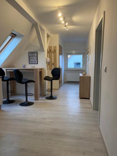 a room with two chairs and a counter in a building at Ferienwohnung Hendrich Roßleben in Roßleben