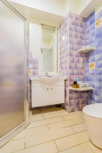 a bathroom with a sink and a toilet at 湯園民宿 l 民宿編號1639 in Taitung City