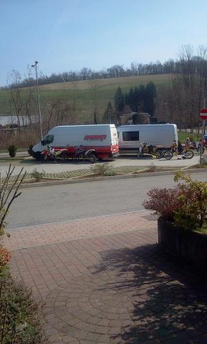 a couple of buses parked in a parking lot at Hotel motel residence Gonzaga in Cantello