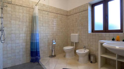 a bathroom with a shower and a toilet and a sink at Villa Berenice in Butkovići
