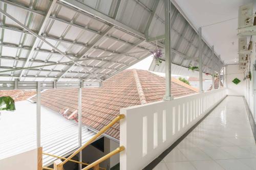 a view of a building with a metal roof at RedDoorz Syariah near Exit Toll Jatiwarna 2 in Pondokmelati