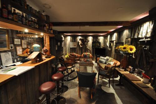 a barber shop with a bunch of chairs and tables at Villa Vimpasaari in Hamina