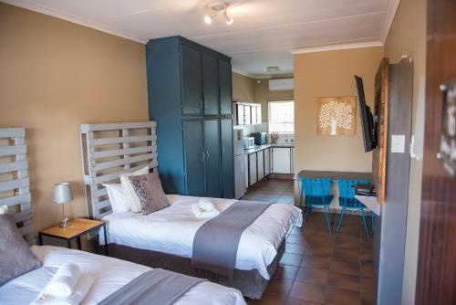 Photo de la galerie de l'établissement Melrose Place Guestrooms, à Potchefstroom