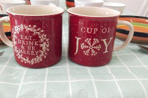 two red coffee mugs with the words cut off drink and beaver at 16pax Seri Austin 4bedroom 4bath nearby toppen aeon tebrau in Johor Bahru