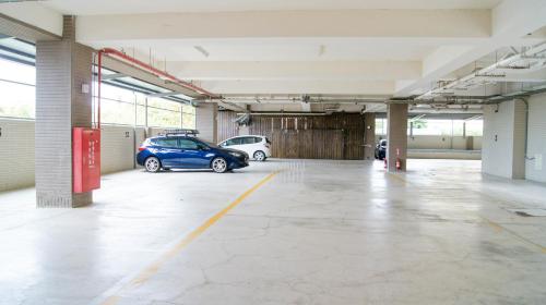 an empty parking garage with two cars parked in it at Kuei Ti Wan Hotel in Checheng