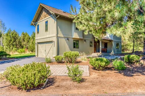 a house with a garage and some bushes at 22 Quelah in Sunriver