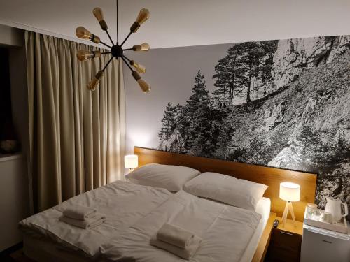 Ένα ή περισσότερα κρεβάτια σε δωμάτιο στο Snowland Apartmány