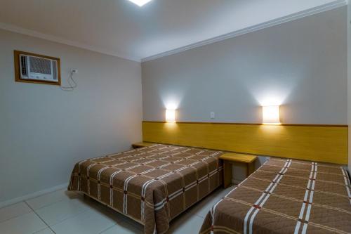 Postel nebo postele na pokoji v ubytování A Furninha Suites