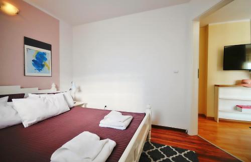 Łóżko lub łóżka w pokoju w obiekcie Plaża Apartament