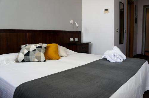 Ένα ή περισσότερα κρεβάτια σε δωμάτιο στο Hotel Ristorante Morus
