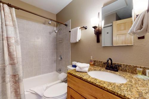 a bathroom with a sink and a toilet and a shower at Remodeled 2 Bedroom East Vail Condo 6G with Hot Tub Market Free Shuttle in Vail