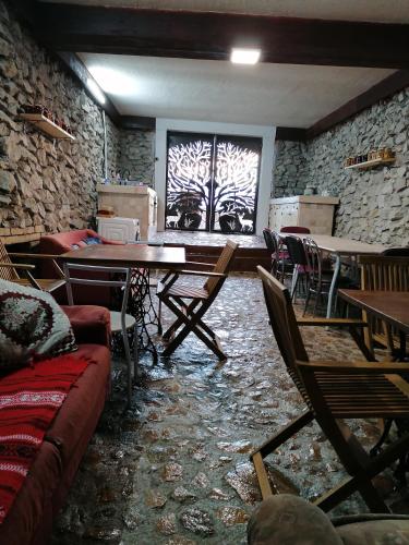 a room with tables and chairs and a window at Wineyards Salin in Turda