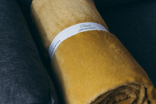 a roll of food with a label on it at HEIMATEL - Suiten, Apartments und Studios in Scheidegg