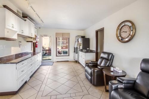 a kitchen and living room with a couch and a table at Motel 6-Lethbridge, AB in Lethbridge