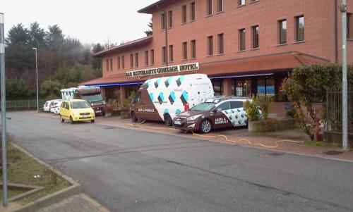 a group of cars parked in front of a building at Hotel motel residence Gonzaga in Cantello