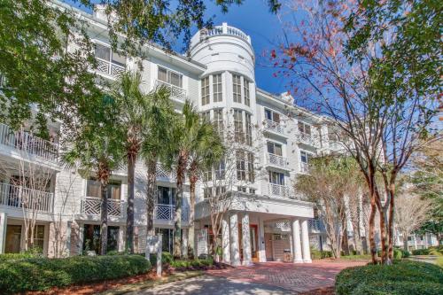 a white building with trees in front of it at Lasata #3112 in Destin