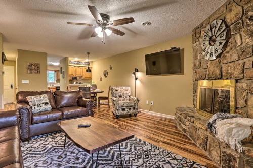 a living room with a couch and a fireplace at Pigeon Forge Condo with Balcony 5 Mi to Attractions in Pigeon Forge