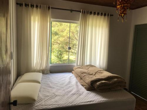 En eller flere senge i et værelse på Casa De campo Santuário Bellatrix