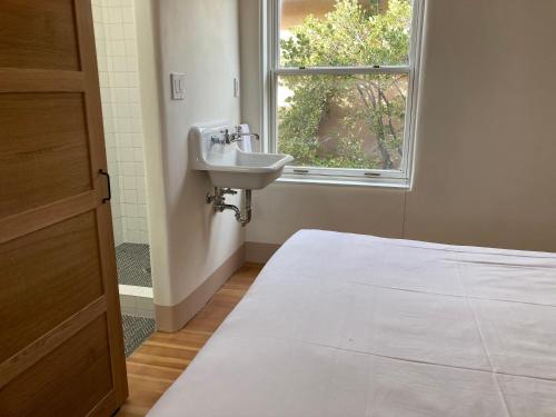 a bathroom with a sink and a window at The Parador in Santa Fe
