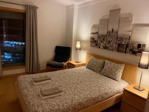 מיטה או מיטות בחדר ב-Suites Panoramic - River View