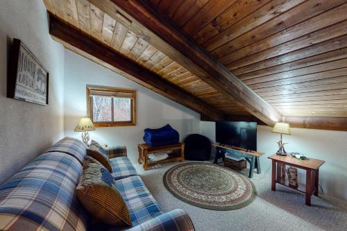 a living room with a couch and a tv at N10 Sandtrap Loop in Bartlett