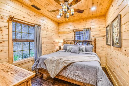 a bedroom with a bed in a log cabin at Alpine Creekside Chalet in Gatlinburg