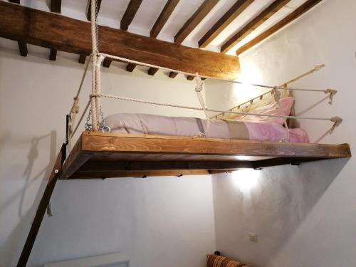 a hammock bed hanging from a ceiling in a room at Etrusco in Chiusi