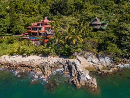 an aerial view of a house on a rocky island at Villa Lala Boutique Hotel Adults Only in Puerto Vallarta