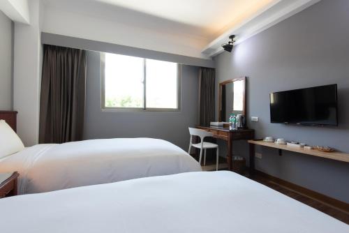 Cama o camas de una habitación en Ola Hotel