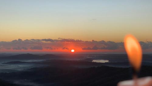 a view of the sunset from the top of a mountain at Silent Hope Cottages in Bald Knob