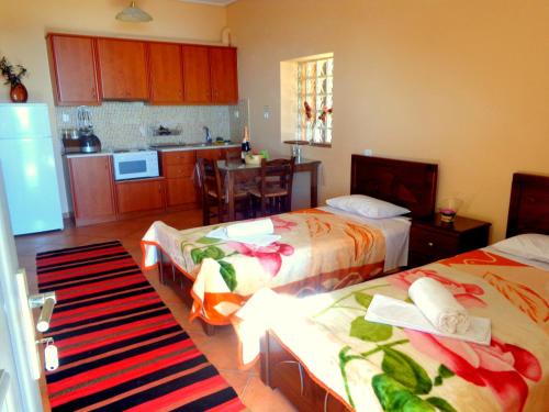 Ένα ή περισσότερα κρεβάτια σε δωμάτιο στο Makronas Apartments
