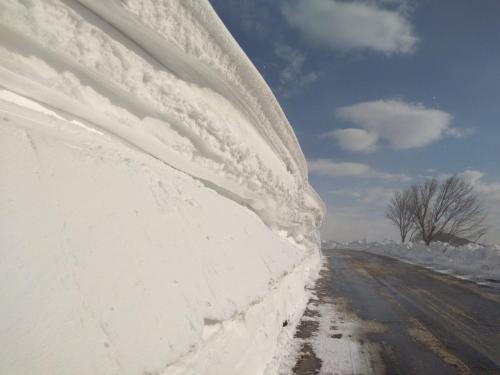 a pile of snow on the side of a road at SanMari_forest in Ledenice