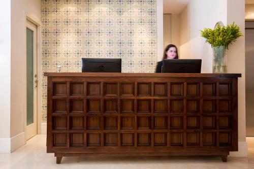a desk with a computer on top of it at Arthur Hotel - an Atlas Boutique Hotel in Jerusalem