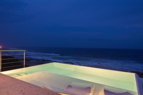 a view of the ocean at night at The Sugar Shack in Ballito