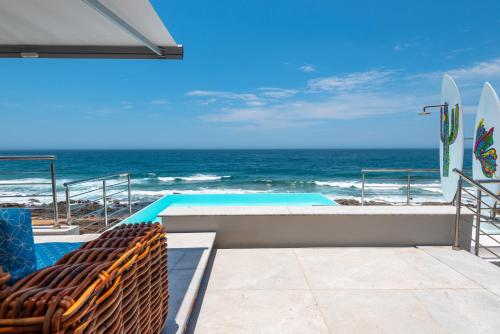 a swimming pool with a view of the ocean at The Sugar Shack in Ballito