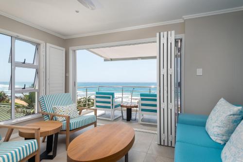 a living room with a view of the ocean at The Sugar Shack in Ballito