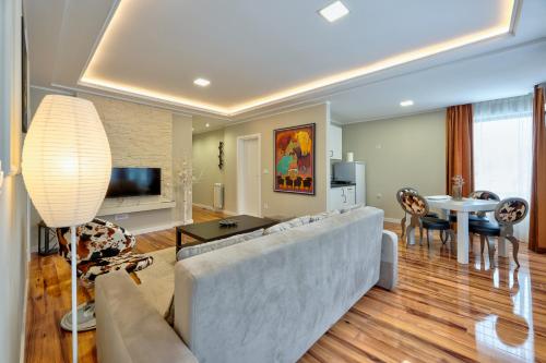 TV a/nebo společenská místnost v ubytování Onix Residence