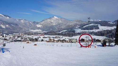a large red object in the snow on a ski slope at Pension Alpina in Reith im Alpbachtal
