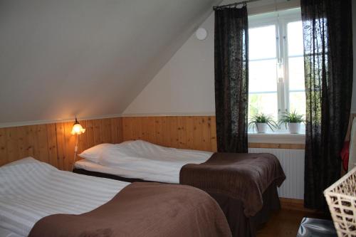 Postel nebo postele na pokoji v ubytování Gällared 710 - Bed & Kitchen