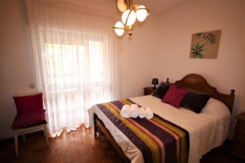 En eller flere senge i et værelse på Apartamento Brás