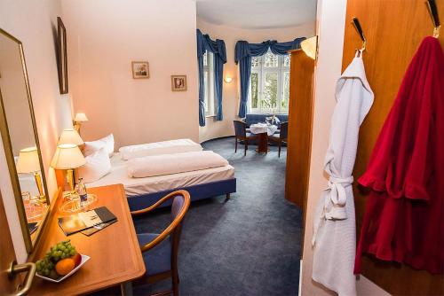 Katil atau katil-katil dalam bilik di Golfhotel Denzerheide