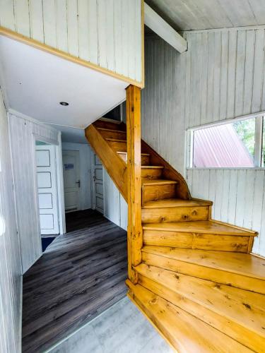 a staircase in a tiny house with a window at Ośrodek Wypoczynkowy AKWA Marina in Nysa