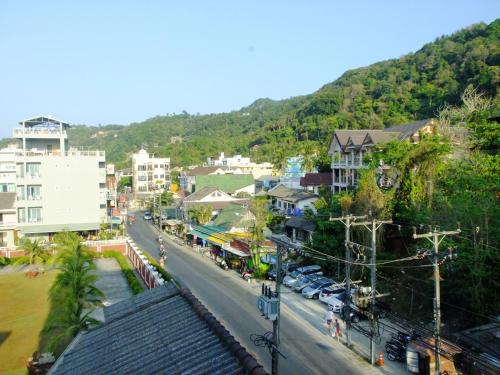 a view of a city street with a mountain at Kata Bai D - SHA Certificate Hotel in Kata Beach