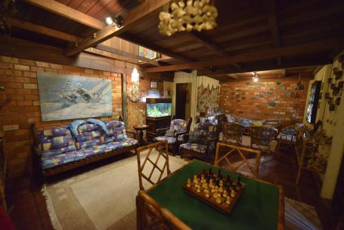 Μια τηλεόραση ή/και κέντρο ψυχαγωγίας στο Hotel Pousada Praia do Farol
