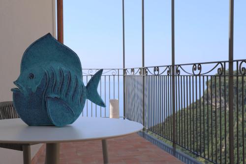 a fish statue sitting on top of a table at Palazzo San Giovanni Amalfi Coast in Scala