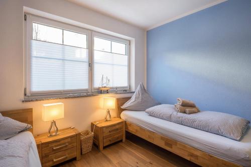 Tempat tidur dalam kamar di Ferienwohnung Lausbub