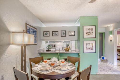 a dining room with a table and chairs at Plantation Hale in Kapaa