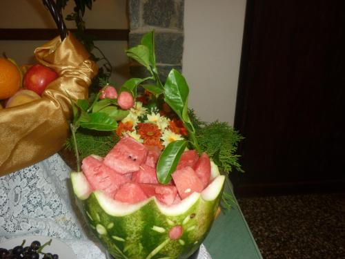 a watermelon cut in half sitting on a table at Hotel Puesta del Sol in Punta del Este
