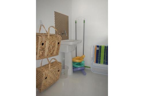 a bathroom with a sink and a toilet and a shower at Flats no Mandakaru Residence (Flats da Elena) in Porto De Galinhas